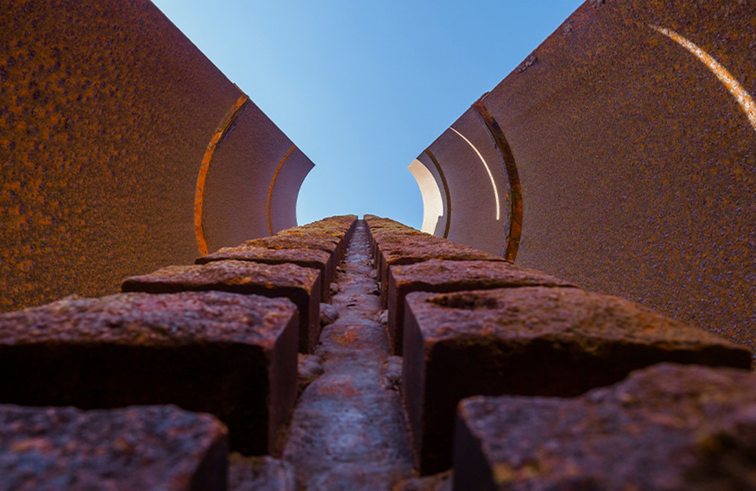 A corroded building from the ground, up